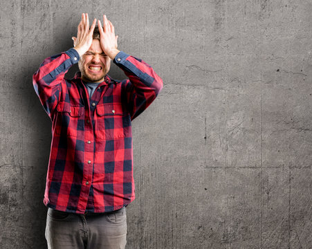 Young handsome man terrified and nervous expressing anxiety and panic gesture, overwhelmed