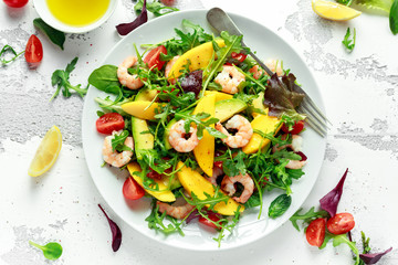 Fresh Avocado, Shrimps, Mango salad with lettuce green mix, cherry tomatoes, herbs and olive oil,...