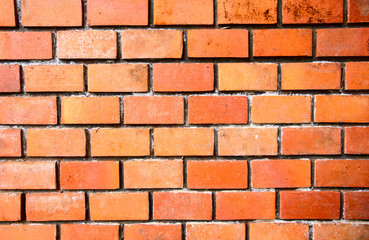 Orange brick wall closeup photo for background. Brickwork closeup. Rustic brick masonry.