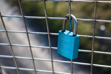 Lockers symbolizing love forever on the fence