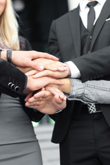 Obraz premium business people folding their hands together.concept of teamwork
