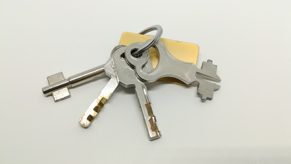set of door and lock key on white background