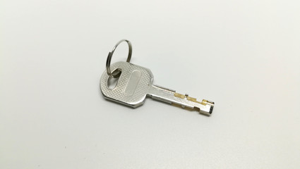single of door or lock key on white background