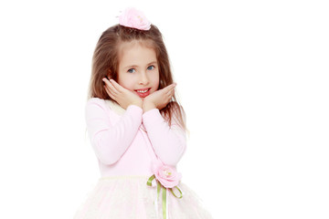 Elegant little girl in a pink dress.
