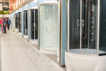 Shower cabins in the sanitary ware shop. inside HomePro store. The store provide advice and facilities for installation and maintenance of a wide range of domestic features.