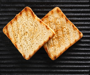 Toasts on the grill. top view. Black background