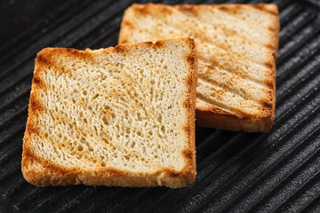 Toasts on the grill. top view. Black background