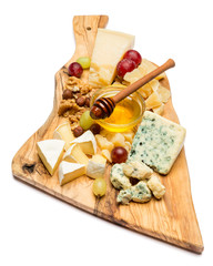 various types of cheese - brie, camembert, roquefort and cheddar