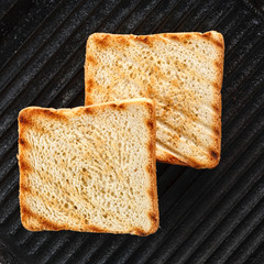 Toasts on the grill. top view. Black background