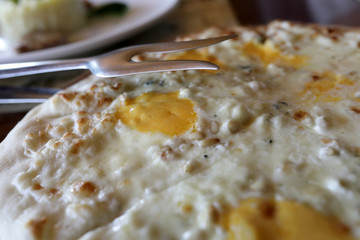 Part of pizza four cheese