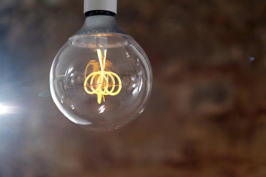 Modern LED lamp with a ball-shaped glass bulb design in retro style