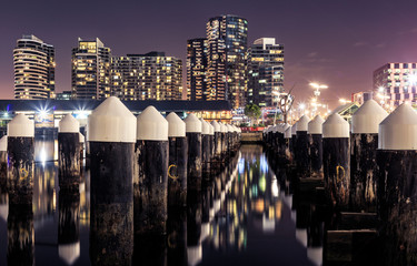 Docklands pilings in front of luxury highrises in Melbourne, Australia