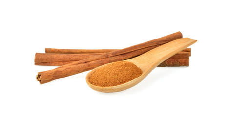 Cinnamon sticks and powder on white background