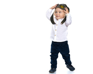 Cute little boy in helmet pilot.