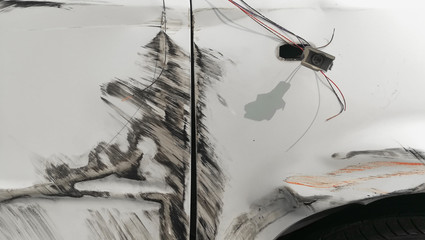 closeup white body car with crash accident damage