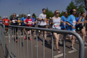 Marathon barrier with blurred people running in the background