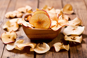 dried apples on wooden table