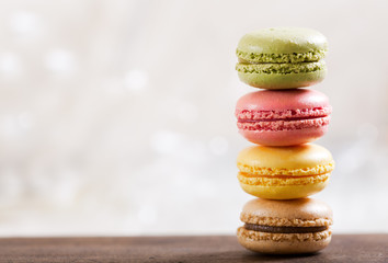 colorful macaroons on wooden table