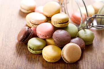 colorful macaroons on wooden table
