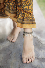 Female ankle with gypsy bracelet