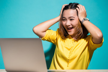 Happy woman when she look at laptop