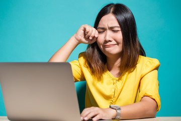 Woman so sad when she look at laptop