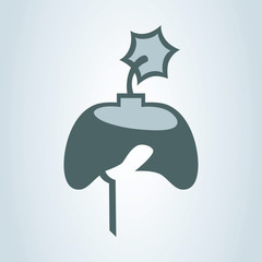 Hand holding game controller with an ignited fuse. Hardcore gaming concept