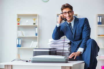 Businessman making copies in copying machine