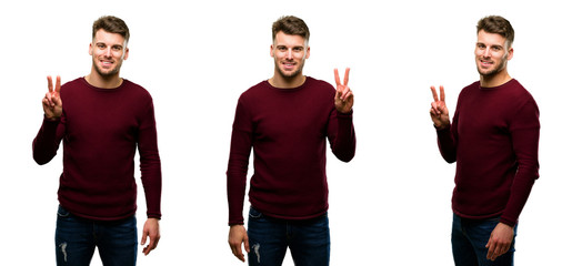 Handsome blond man raising his fingers, number two isolated over white background
