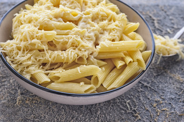 dishes pasta sprinkled with cheese close-ups in a ceramic plate