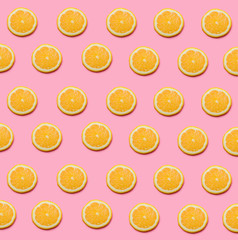 Fresh lemon pattern on a vivid pink background flat lay