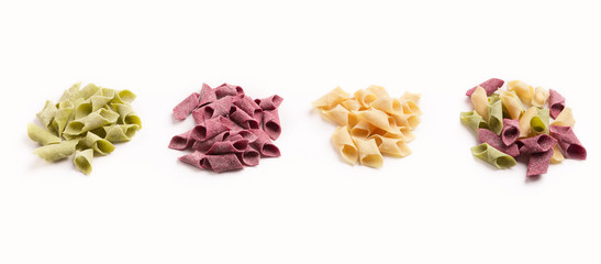 Mixture of different colorful garganelli isolated