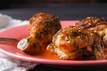 Marinated grilled healthy chicken breasts cooked on a summer BBQ and served with fresh herbs