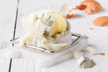 Egg slicer - cutter on white table