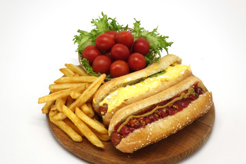 Hot dogs and French fries on white background.