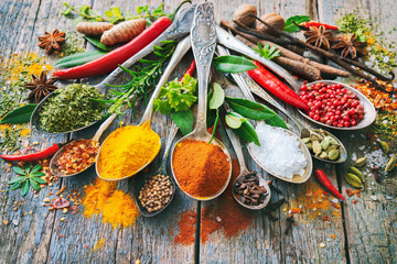 Various herbs and spices with spoons