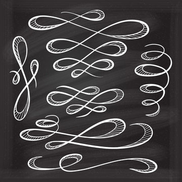Chalk decorative curls and swirls design elements on a chalkboard background 