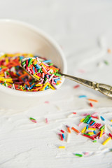 culinary sprinkling, cooking dressing in a Cup with a spoon on light background, close up
