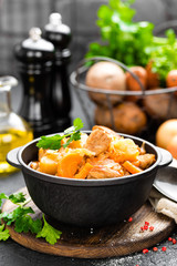 Meat stew with vegetables. Braised meat with cabbage, carrot and potato
