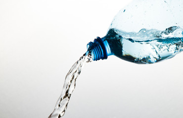 Naklejka na ściany i meble splash water out of a bottle