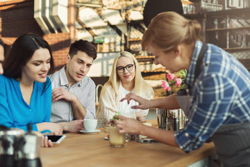 Experienced smiling barista giving master class