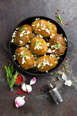 Baked potato. Potato oven baked with garlic and rosemary
