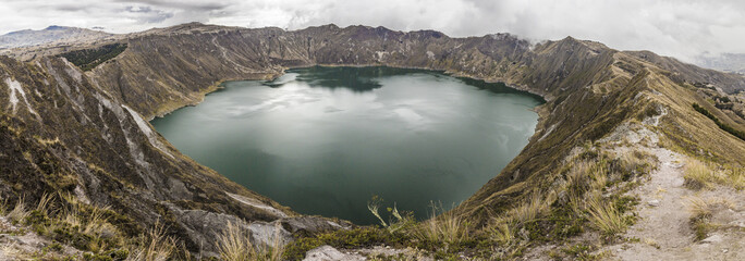 Panoramic view of Quilotoa lake, rounded and inside a volcanic crater