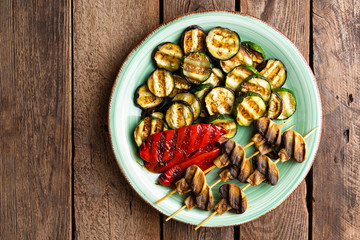 Grilled vegetables and mushrooms. Grilled zucchini, eggplant, sweet pepper and mushrooms on plate