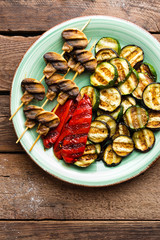 Grilled vegetables and mushrooms. Grilled zucchini, eggplant, sweet pepper and mushrooms on plate