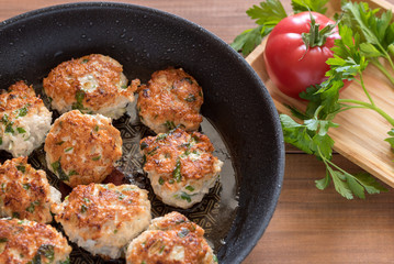 Fried turkey cutlets in a pan.