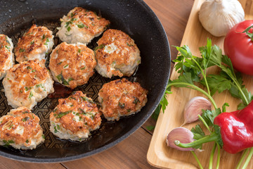 Fried turkey cutlets in a pan.
