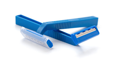 blue disposable shavers on a white background
