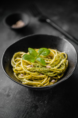 Delicious served pasta in black plate