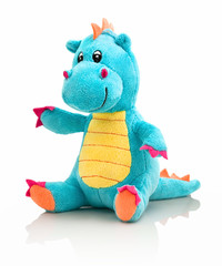 Dragon plushie doll isolated on white background with shadow reflection. Dragon plush stuffed puppet on white backdrop. Dino plushie toy. Aqua color stuffed dinosaur toy. Lizard toy sitting on white